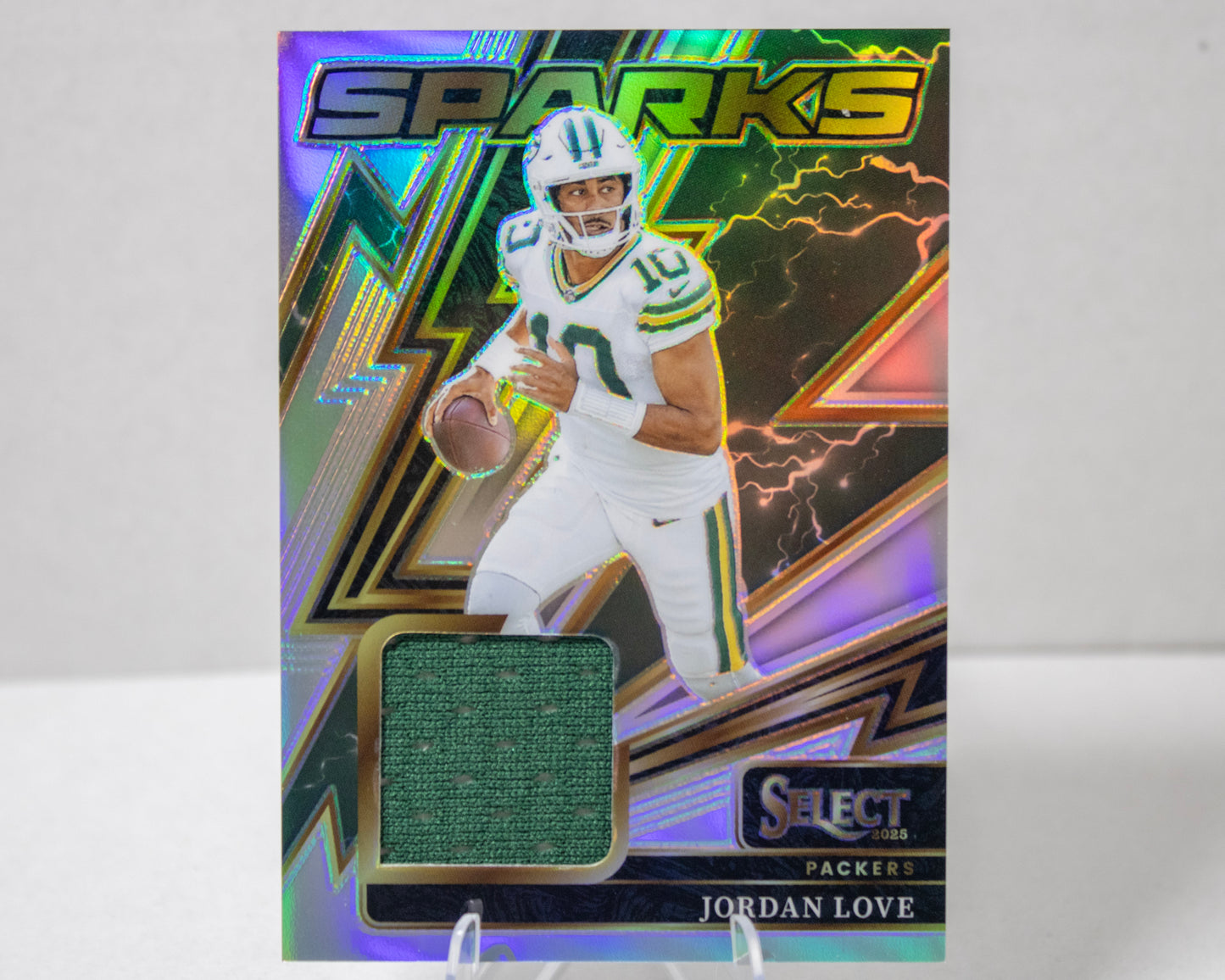 Jordan Love – Panini Select Sparks Memorabilia /149 (No. SPK‑JLE)